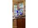 The kitchen features a granite countertop, double sink, and window with backyard views at 930 E Page St, Gilbert, AZ 85234