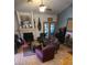 Comfortable living room featuring a fireplace, vaulted ceilings, and French doors at 930 E Page St, Gilbert, AZ 85234