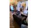 Open-concept living space with dining area and kitchen visible, featuring tile flooring and comfortable seating at 930 E Page St, Gilbert, AZ 85234