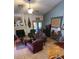 Inviting living room with fireplace, vaulted ceiling, and French doors, perfect for relaxing or entertaining at 930 E Page St, Gilbert, AZ 85234