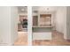 Open living area with kitchen view, tiled flooring, and breakfast bar seating at 930 E Page St, Gilbert, AZ 85234
