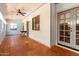 Enclosed sun room featuring tile floors, light blue walls, a ceiling fan and windows at 930 E Page St, Gilbert, AZ 85234