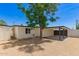 View of the backyard with gravel and a large tree at 9602 N 5Th Ave, Phoenix, AZ 85021