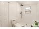 Modern bathroom with a walk-in shower, white subway tiles, and a dual shower head at 9602 N 5Th Ave, Phoenix, AZ 85021
