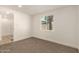 Carpeted bedroom with natural light and a view of the outside at 9602 N 5Th Ave, Phoenix, AZ 85021