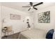 Well-lit bedroom with neutral walls, plush carpet, and decorative wall art at 9602 N 5Th Ave, Phoenix, AZ 85021
