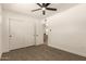 A well lit bedroom with a ceiling fan and closet at 9602 N 5Th Ave, Phoenix, AZ 85021