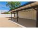 View of the white and black carport and the tree at 9602 N 5Th Ave, Phoenix, AZ 85021