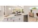 Open kitchen view with bright modern appliances connecting to a cozy living space at 9602 N 5Th Ave, Phoenix, AZ 85021