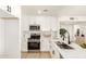 Modern kitchen features white cabinets, stainless steel appliances, and quartz countertops at 9602 N 5Th Ave, Phoenix, AZ 85021