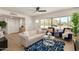 Inviting living room featuring a large window, stylish furnishings, and bright wood floors at 9602 N 5Th Ave, Phoenix, AZ 85021