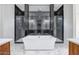 The primary bathroom offers dual shower, stand alone tub, and stylish fixtures at 9705 E Sector Dr, Mesa, AZ 85212
