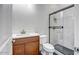 Bathroom featuring tiled shower with black hardware and light wood vanity at 9705 E Sector Dr, Mesa, AZ 85212