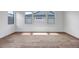 A bright bedroom with hardwood floors and ample natural light at 9705 E Sector Dr, Mesa, AZ 85212