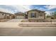 Beautiful single-Gathering home featuring a three-car garage and low-maintenance landscaping at 9705 E Sector Dr, Mesa, AZ 85212