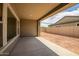 A covered outdoor patio overlooking a spacious backyard at 9705 E Sector Dr, Mesa, AZ 85212