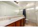 Bright bathroom featuring neutral paint, flooring, vanity and countertop at 10313 W Windsor Ave, Avondale, AZ 85392