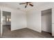 Neutral bedroom featuring neutral paint, carpeted floors, ceiling fan and closet at 10313 W Windsor Ave, Avondale, AZ 85392