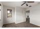 Neutral bedroom showcasing the window and closet with neutral paint, carpeted floors, and ceiling fan at 10313 W Windsor Ave, Avondale, AZ 85392