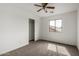 Neutral bedroom featuring neutral paint, carpeted floors, ceiling fan and closet at 10313 W Windsor Ave, Avondale, AZ 85392