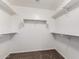 Carpeted walk-in closet with white trim and shelving at 10313 W Windsor Ave, Avondale, AZ 85392