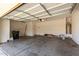 Spacious two car garage with a newer opener, water heater, and room for storage at 10313 W Windsor Ave, Avondale, AZ 85392