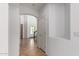 Bright hallway with tile flooring leads to a staircase and an arched entryway at 10313 W Windsor Ave, Avondale, AZ 85392