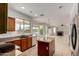 Kitchen with granite countertops, stainless steel appliances, and a center island at 10313 W Windsor Ave, Avondale, AZ 85392