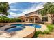 Beautiful private in-ground pool and hot tub area with a large patio for entertaining at 10313 W Windsor Ave, Avondale, AZ 85392