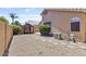 Spacious backyard featuring low maintenance desert landscaping and a covered outdoor dining area at 11550 W Mule Deer Ct, Surprise, AZ 85378