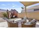 Inviting backyard with patio seating area and a covered gazebo with an outdoor dining set at 11550 W Mule Deer Ct, Surprise, AZ 85378
