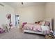 bedroom with a white bed, carpet, and an open closet, ideal for play and relaxation at 11550 W Mule Deer Ct, Surprise, AZ 85378