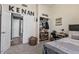 Stylish bedroom with modern decor, featuring an open closet and ample space at 11550 W Mule Deer Ct, Surprise, AZ 85378