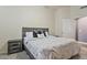 Comfortable bedroom with a queen-size bed, soft carpet, and a neutral color palette, perfect for relaxation and rest at 11550 W Mule Deer Ct, Surprise, AZ 85378