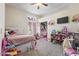 bedroom featuring a white bed, toys, and carpet, ideal for a comfort and play at 11550 W Mule Deer Ct, Surprise, AZ 85378