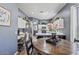 Charming eat-in kitchen area with a desk area, white cabinets, and natural light at 11550 W Mule Deer Ct, Surprise, AZ 85378