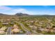 Expansive aerial shot of a desert community surrounded by rolling hills and scenic mountain landscapes at 13614 N 12Th Way, Phoenix, AZ 85022