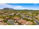 Panoramic aerial view of a sprawling community with lush desert landscaping and mountain backdrop at 13614 N 12Th Way, Phoenix, AZ 85022