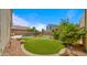 Lush backyard with a sparkling pool, manicured lawn, and privacy landscaping, offering a private outdoor retreat at 13614 N 12Th Way, Phoenix, AZ 85022