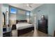 Stylish bedroom with modern furniture, wood-look flooring, and multiple windows for abundant natural light at 13614 N 12Th Way, Phoenix, AZ 85022