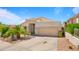 Charming single-story home with a well-maintained desert landscape, spacious driveway and attached garage at 13614 N 12Th Way, Phoenix, AZ 85022