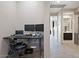 Functional home office with dual monitors and neutral tones, offering a productive workspace with hallway access at 13614 N 12Th Way, Phoenix, AZ 85022