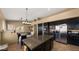 Bright eat-in kitchen features granite counters, island, stainless steel appliances, and tile floors at 13614 N 12Th Way, Phoenix, AZ 85022