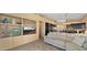 Open-concept living area with built-in shelving, media center, and seamless flow to the kitchen at 13614 N 12Th Way, Phoenix, AZ 85022