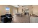 Bright and airy living area showcasing tile flooring, natural light, and seamless flow to the dining and kitchen spaces at 13614 N 12Th Way, Phoenix, AZ 85022