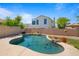 Beautiful backyard swimming pool with lush landscaping, offering a relaxing outdoor oasis for leisure and entertainment at 13614 N 12Th Way, Phoenix, AZ 85022
