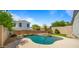 Inviting backyard swimming pool surrounded by a well-maintained yard, perfect for summer relaxation and recreation at 13614 N 12Th Way, Phoenix, AZ 85022