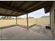 Large back yard features dirt landscaping, block fence, and covered patio area at 1404 S Spencer --, Mesa, AZ 85204