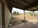 Large back yard features dirt landscaping, block fence, and covered patio area at 1404 S Spencer --, Mesa, AZ 85204
