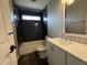 Bathroom with a toilet, sink and tiled shower at 1404 S Spencer --, Mesa, AZ 85204